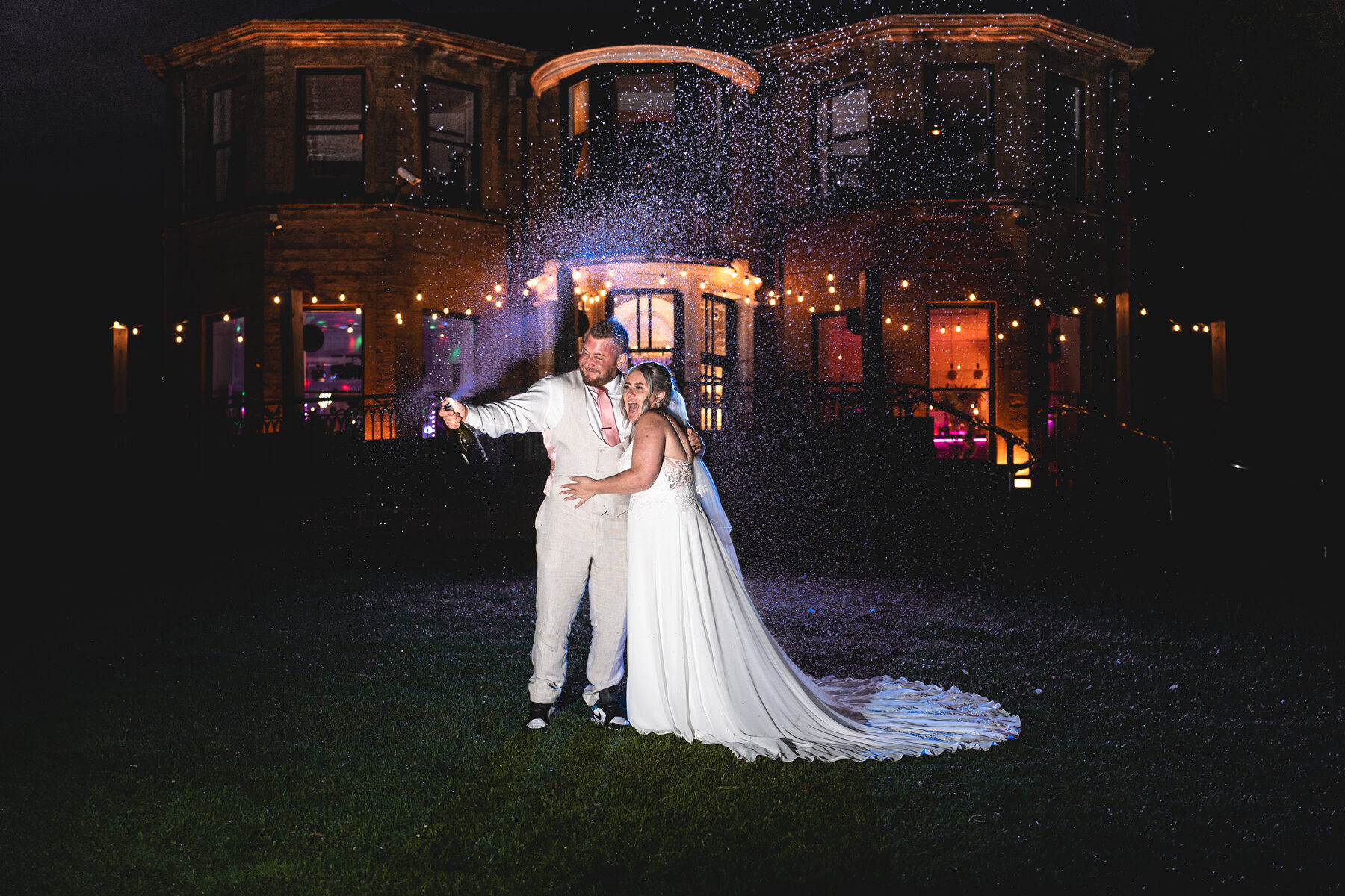 Newlyweds sharing an evening portrait in the rain
